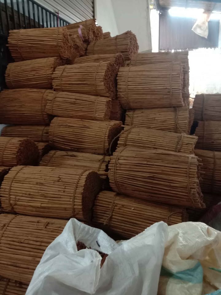 Warehouse stacked with bulk Ceylon Cinnamon quill bales, ready for wholesale orders